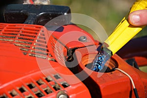 Refueling Chainsaw Close Up