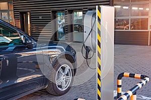 Refueling for electric cars e-mobility, the electric plug under voltage restores the battery charge
