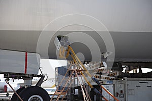 Refueling the plane at the airport. Close-up, place for text
