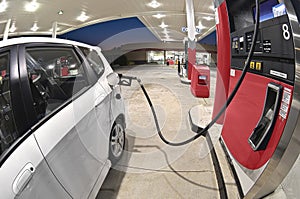 Refueling Small Economy Car At Gasoline Station Revised