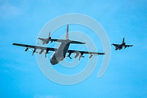 Refueling two jet fighters in-flight