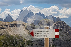 Refuge sign in front of the Three Peaks in the Dolomites