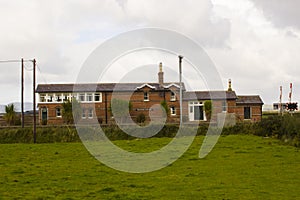 The refurbished automatic rail crossing and station house at Magilligan on the North coast of Ireland in County Londonderry on a d