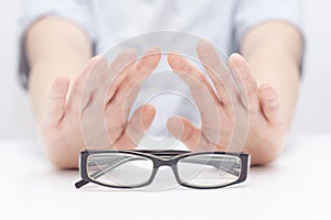 Refusal of glasses for sight. hands refuse glasses. cross on glasses. Vision improvement,