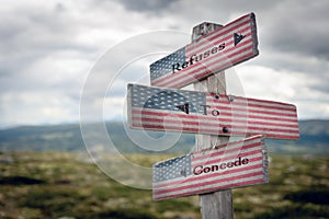 refuses to concede text on wooden signpost outdoors with the american flag