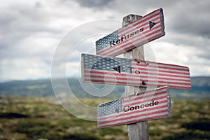 refuses to concede text on wooden signpost outdoors with the american flag photo