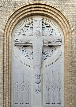 Regal figure of Christ on the facade of Christ the King Catholic Church in Dallas, Texas.