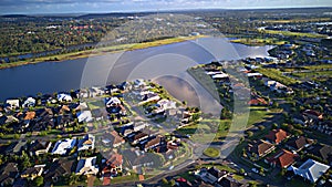 Regatta Waters Estate next to Coomera River Morning view Hope Island, Gold Coast with large housing estate