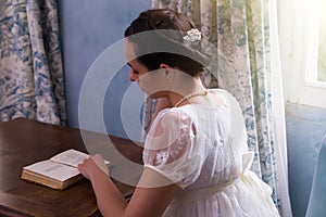 Regency woman reading book