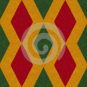 Reggae colors crochet knitted style background, top view. Collage with mirror reflection with rhombus. Seamless kaleidoscope monta