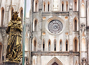 Regina Pacis Queen of Peace Statue in front of St. Joseph`s Cathedral, Hanoi, Vietnam. St. Joseph`s Cathedral is a Neogothic photo