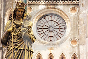 Regina Pacis Queen of Peace Statue in front of St. Joseph`s Cathedral, Hanoi, Vietnam. St. Joseph`s Cathedral is a Neogothic photo