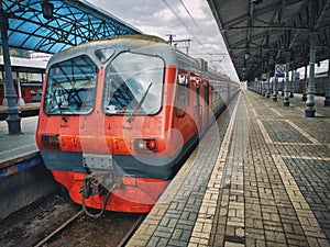 The regional electric train stopped at a platform