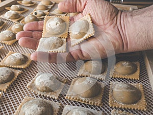 Regional food - hand with handmade raviolis