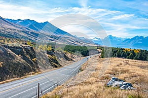 Regional road at Lake Pukaki with Mt. Cook in background the highest mountain in New Zealand. South Island. New Zealand