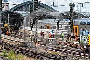 Regional train incoming in station in Cologen / Germany while workers build new rail tracks