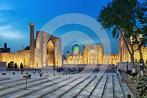 Registan square at dusk in Samarkand, Uzbekistan photo