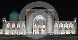 Registan Square at night. Samarkand. Uzbekistan. the inscription above the gate in a special Arabic script it says Lord