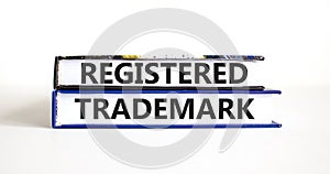 Registered trademark symbol. Concept word Registered trademark on books. Beautiful white table white background. Business and