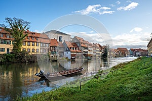 Regnitz River riverbank with small boats and old houses - Bamberg, Bavaria, Germany