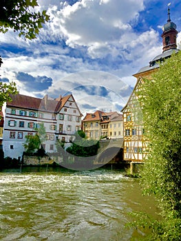 Regnitz river running through the old town of Bamberg on a beautiful German summerâ€™s day.