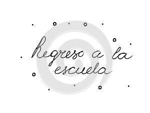 Regreso a la escuela phrase handwritten with a calligraphy brush. Back to school in spanish. Modern brush calligraphy. Isolated photo