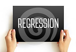 Regression is a set of statistical processes, text concept on card photo