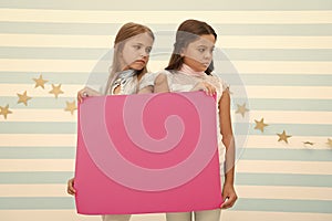 Regret to inform you. Girls hold advertisement poster copy space. Children hold advertising banner. Sad kids with blank