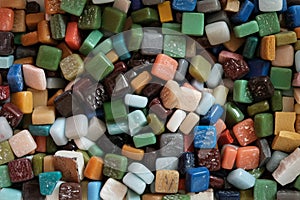 Regular or irregular pieces of colored stone, glass or ceramic known as smalt for decorative art mosaic, close-up. Mosaico hobby photo