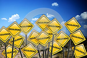 Regulation concept on yellow road sign with blue sky