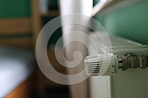 Regulator of heating system radiator in the bedroom