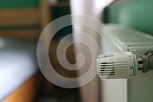 Regulator of heating system radiator in the bedroom