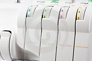 Regulators of a tension of threads on overlock