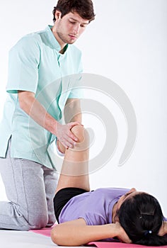 Rehabilitating patient's knee photo