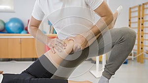 Rehabilitation leg treatment to a female patient