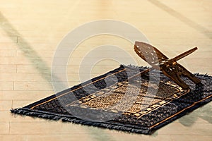 Rehal on Muslim prayer mat indoors