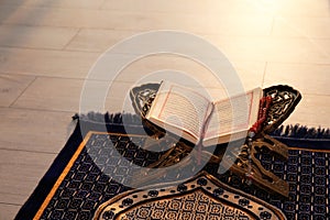 Rehal with open Quran and Muslim prayer beads