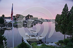 Rehoboth Beach, Delaware, U.S - August 3, 2022 - The view of boat dock and luxury waterfront homes by the bay in early morning