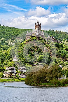 The Reichsburg Cochem Imperial Castle Cochem on a hill over the Moselle river.