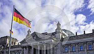 Reichstag building in Berlin, Germany. Under view, part of facade cloudy sky background