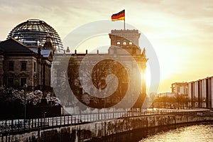 Reichstag building and bundestag district in Berlin - Germany during sunset