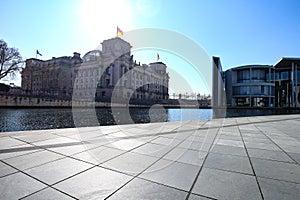 The Reichstag, german parliament building, as seen from the banks of Spree river in Berlin, Germany