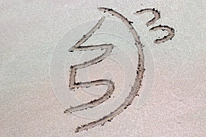 Reiki healing symbol sei he ki on sand.