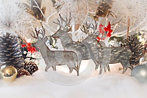 Reindeer Decorations in Snow with Pine Cones