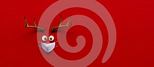 Reindeer toy with cold red nose and medical mask on red Christmas Corona background