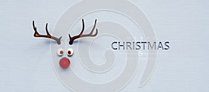 Reindeer toy with red nose Christmas background concept