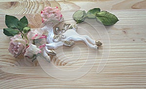 Reindeer in water drops decorated with roses and leaves