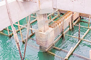 Reinforce concrete beams and precast slabs of under construction pier