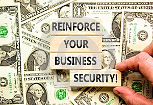 Reinforce your business security symbol. Concept word Reinforce your business security on blocks. Beautiful background from dollar