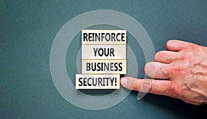 Reinforce your business security symbol. Concept word Reinforce your business security on blocks. Beautiful grey table grey